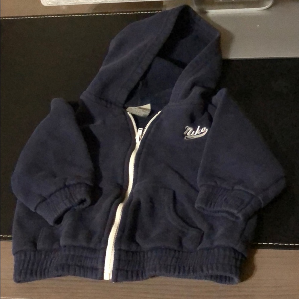 Baby Nike jacket and wrangler jeans